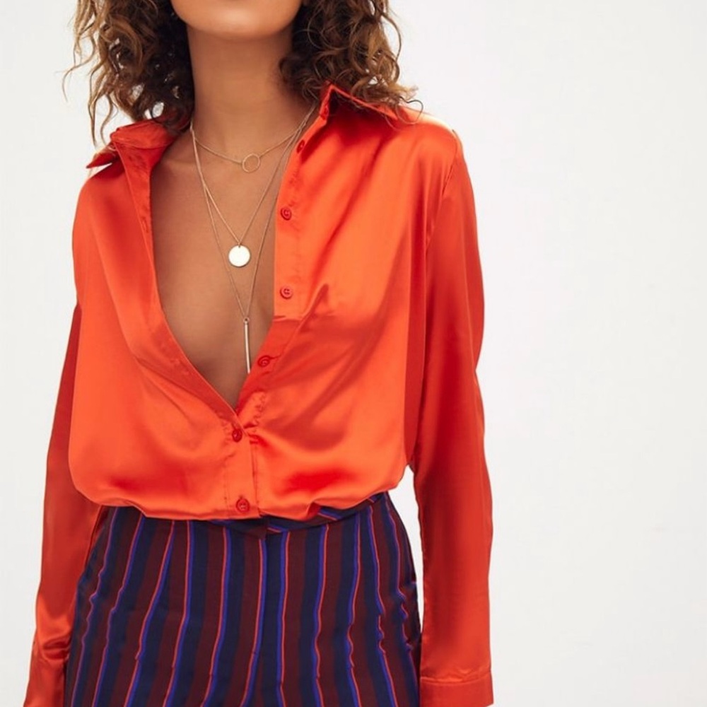 PrettyLittleThing Orange Satin Button Front Shirt.